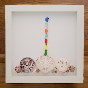 sea glass birds, sea glass handmade art, sea shell home decor, colorful sea birds on top of each other standing on large and small shells