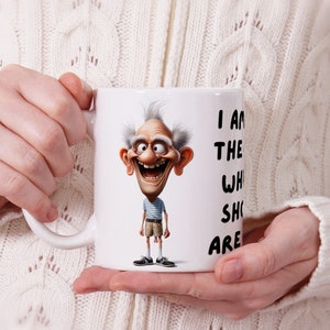 Funny mens mug design showing an older person, wearing shorts with his testicles hanging out. The design is showcased to show how the mug will look when sublimated onto a physical mug. Fathers Day Mug Sublimation Design
