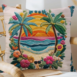May include: Embroidered square cushion depicting a tropical beach scene. The design includes two palm trees, a sunset, ocean waves, and colourful flowers. Sunglasses are also included. The cushion is on a light beige background.