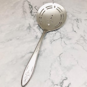 May include: A rustic wooden sign with the text "Welcome to our home" in white lettering. The sign features a distressed finish and a simple, inviting design, perfect for front door decor.