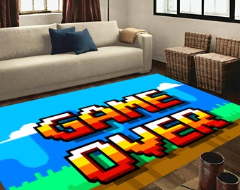 May include: A blue, green, yellow, orange, and red pixelated rug with the words "GAME OVER" in white.