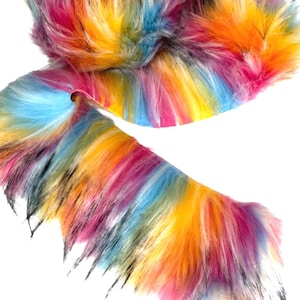 May include: A colorful rainbow faux fur trim with long, fluffy fibers. The trim is a mix of pink, yellow, blue, and black.
