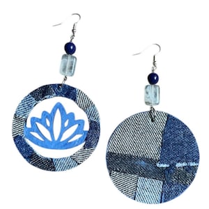 May include: A set of three ceramic nesting bowls in shades of blue, green, and white. The bowls feature a speckled glaze and a simple, modern design. The largest bowl measures approximately 8 inches in diameter.