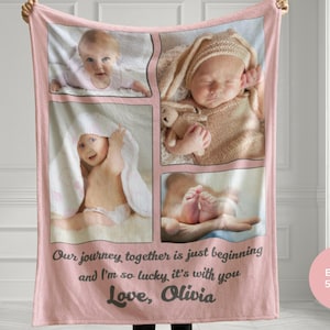 May include: A pink fleece blanket with four photos of a baby. The blanket has the text "Our journey together is just beginning and I'm so lucky it's with you Love, Olivia" printed on it. The blanket is 50 inches by 60 inches.