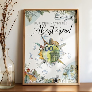 Puede incluir: Impresión artística enmarcada con el texto alemán "FÜR DEIN NÄCHSTES Abenteuer!". Presenta un billete de 100 euros rodeado de iconos de viaje, como la Torre Eiffel y aviones, en un marco de madera.