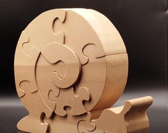 P74-Zirbenholz Puzzle SchneckeZirbenholz Puzzle Schnecke