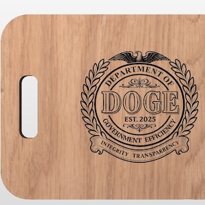 May include: Wooden cutting board with a handle cutout. The board features a laser-etched design of a circular emblem with the text "DEPARTMENT OF DOGE EST. 2025" and the words "GOVERNMENT EFFICIENCY, INTEGRITY, TRANSPARENCY".