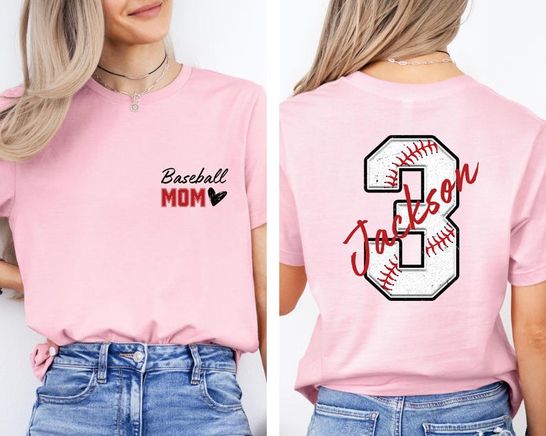 May include: Pink baseball mom t-shirt with black text that says "Baseball Mom" and a red heart. The back of the shirt has a white baseball with red stitching and the number 3 with the name "Jackson" written on it.