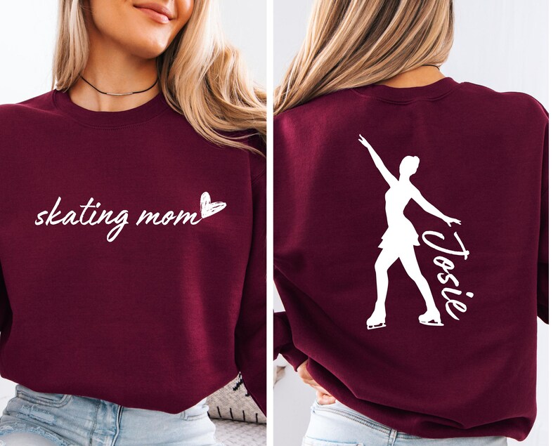 May include: Burgundy sweatshirt with the text "skating mom" and a heart on the front. The back of the sweatshirt has a white silhouette of a figure skater with the name "Josie" written next to it.