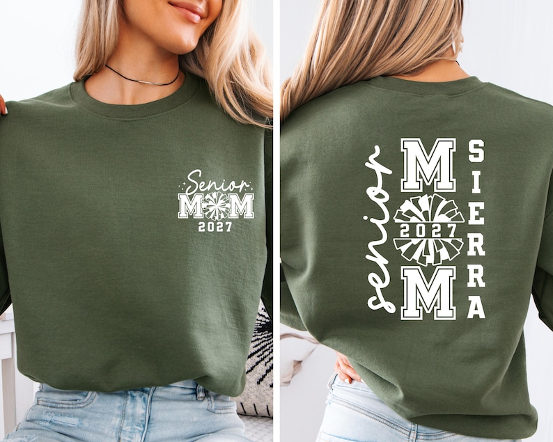 May include: Olive green sweatshirt with white text. The front features "Senior Mom 2027" with a cheerleader graphic. The back displays "Sierra Mom 2027" in a vertical and stacked layout, also with a cheerleader graphic.