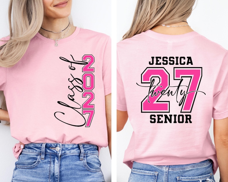May include: A light pink t-shirt with the text "Class of 2027" in black script and pink block letters. The back of the shirt features the name "Jessica", the number "27", and the word "Senior".