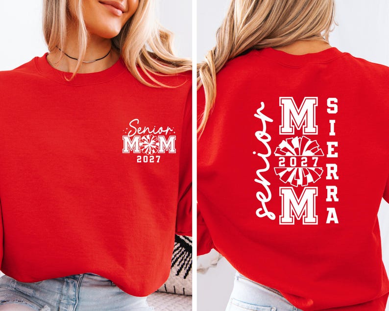 May include: Red sweatshirt with white text and graphics. The front features "Senior Mom 2027" in a script font. The back displays "Sierra Mom 2027" with a cheerleader graphic.