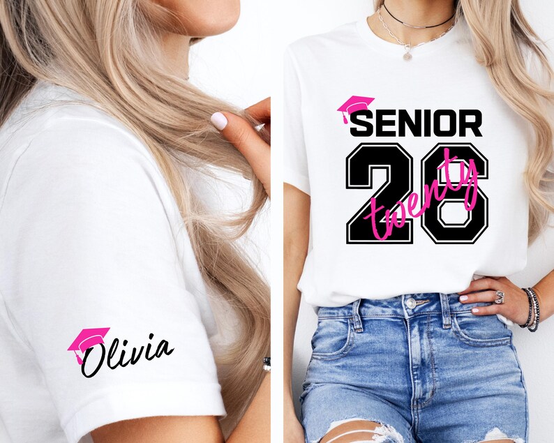 May include: White t-shirt with a black and pink graphic design. The design includes the word "SENIOR" above the number "20" in a black outlined font, with the word "Twenty" in pink. A pink graduation cap is also included. The sleeve has a pink graduation cap and the name "Olivia".