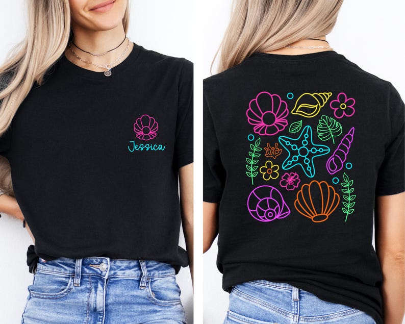 May include: Black t-shirt with a seashell design and the name "Jessica" in teal. The back of the shirt features a colorful neon design of seashells, starfish, and flowers. The shirt is made of a soft material.