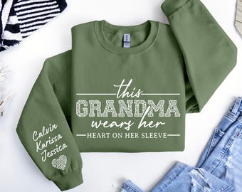 Custom Grandma Sweatshirt, This Grandma Wears Her Heart On Her Sleeve Sweater, With Kids Name On Sleeve, Grandma Sweater,Custom Grandma Gift