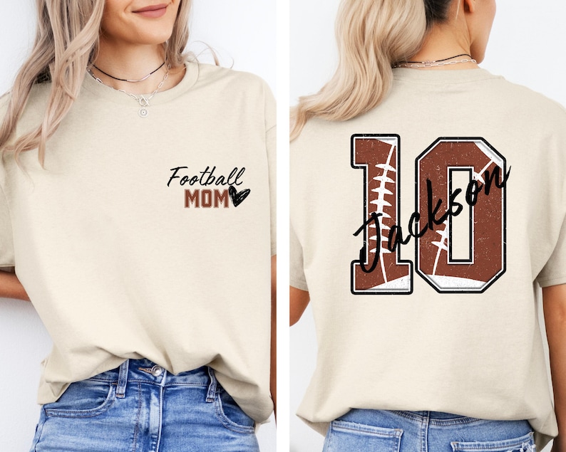 May include: A beige t-shirt with the text "Football Mom" and a heart on the front. The back of the shirt has a brown and white football design with the number 10 and the text "Jackson" on it.