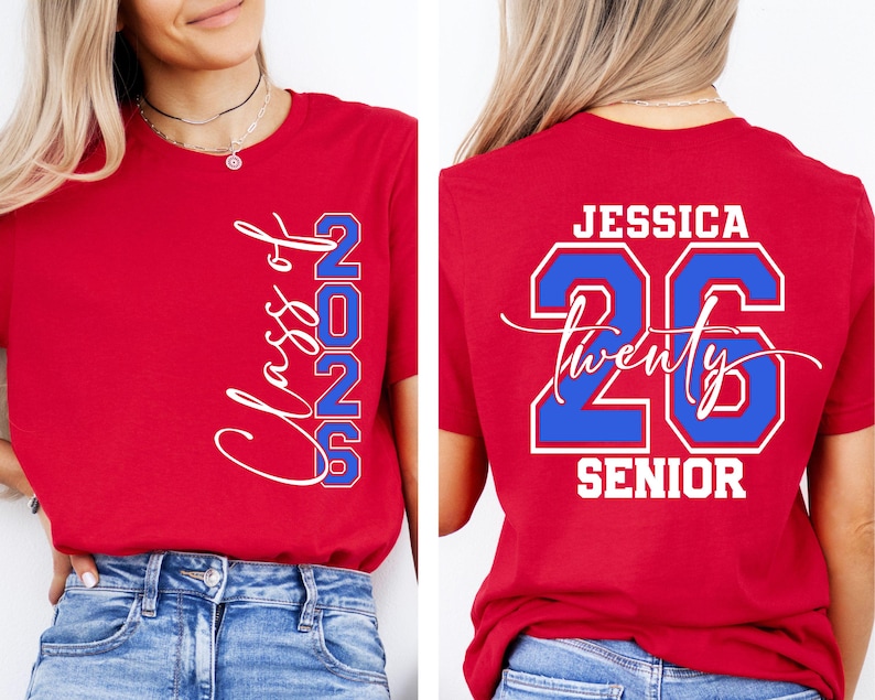 May include: Red t-shirt with white and blue text. The front of the shirt says "Class of 2026" in a script font. The back of the shirt says "Jessica 26 Twenty Senior" in a bold font.