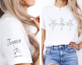 May include: White t-shirt with a line drawing of three ballerinas and the name "Jessica" printed on the front.