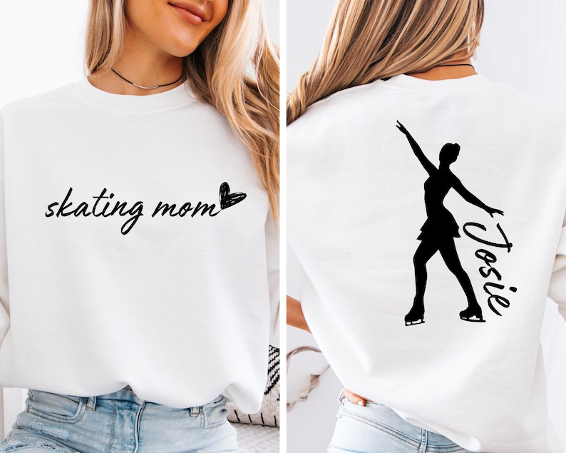May include: White sweatshirt with the text "skating mom" and a heart on the front. The back of the sweatshirt has a silhouette of a figure skater with the name "Josie" written next to it.