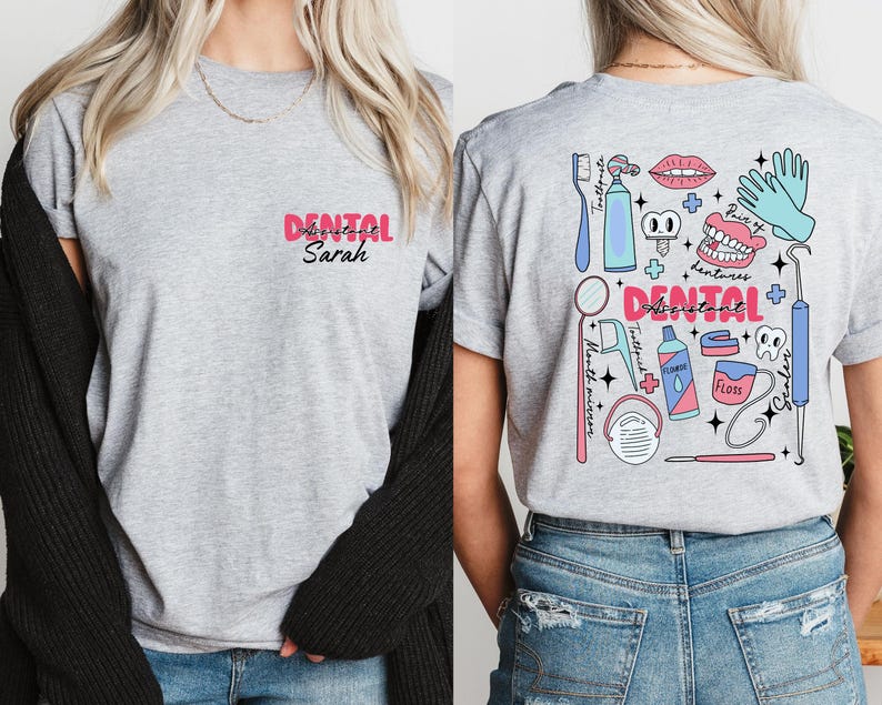 May include: Grey t-shirt with a pink "Dental Assistant Sarah" text on the front and a colourful illustration of dental tools and equipment on the back.