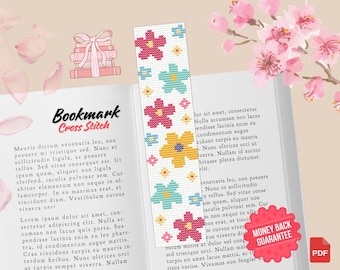 Puede incluir: Un patrón de punto de cruz para marcapáginas con un diseño floral con flores rosas, amarillas, azules y verdes sobre un fondo blanco. El patrón se titula "Bookmark Cross Stitch".