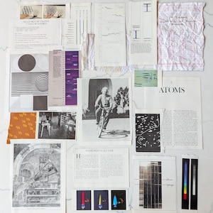 May include: A collection of vintage scientific documents and illustrations, including graphs, diagrams, and text. A black and white photo of Albert Einstein riding a bicycle is featured. The documents are arranged on a white surface.