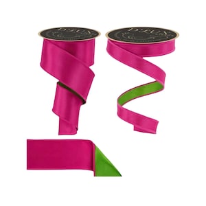 May include: Two spools of double-sided ribbon featuring a vibrant fuchsia pink satin finish on one side and a bright lime green matte finish on the reverse. Each spool is topped with a black circular label printed with the text D'LUX RIBBON.