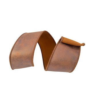 May include: A wide, flexible ribbon featuring a metallic copper-toned finish with a textured, mottled appearance. The ribbon is curled into an S-shape, displaying a smooth, solid brown underside and finished edges with a stitched border detail.