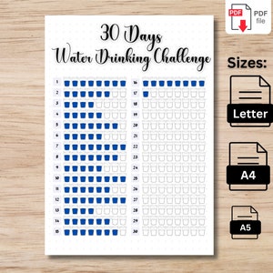 May include: A printable 30 Days Water Drinking Challenge chart. The chart features a grid of cups to track water intake, with the title "30 Days Water Drinking Challenge" in elegant script. Available in Letter, A4, and A5 sizes.