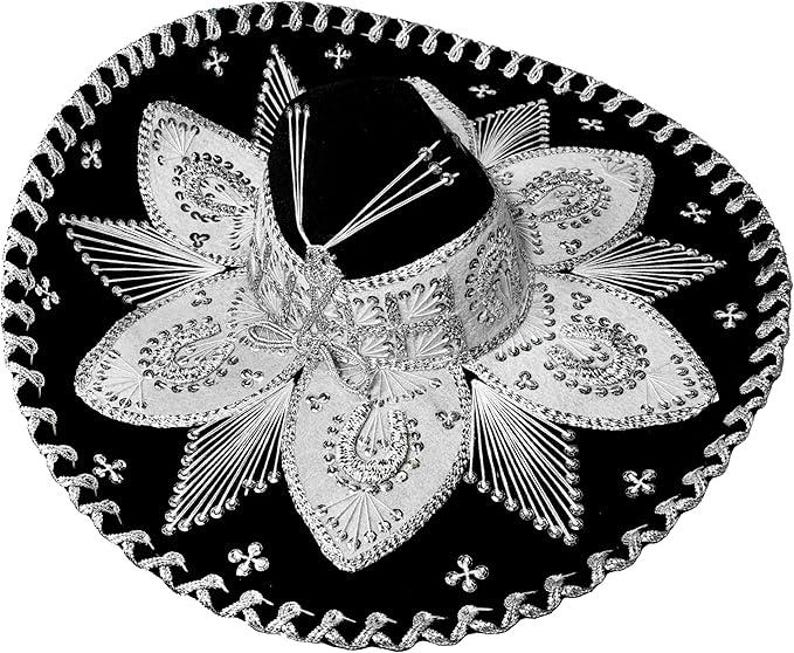 May include: A black sombrero with elaborate silver embroidery and embellishments. The hat features a wide brim and a tall, rounded crown. The design includes floral patterns and decorative stitching, creating a festive and traditional look.