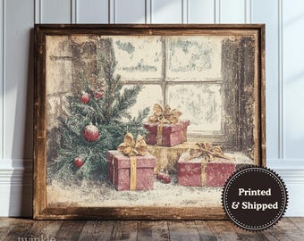 May include: A framed print depicting a Christmas scene. A Christmas tree with red ornaments and wrapped gifts with gold bows are in front of a window. The print has a vintage, rustic style.