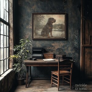 May include: A vintage-style interior scene featuring a framed dog portrait above a wooden desk. The room has a rustic aesthetic with a large window, a potted plant, and a wooden chair. The wall is painted in dark, textured tones.