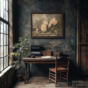 May include: A vintage-style interior scene featuring a wooden desk, chair, and a framed floral painting. A potted plant sits near a large window. The wall is dark with a textured finish. The image has a warm, inviting aesthetic.