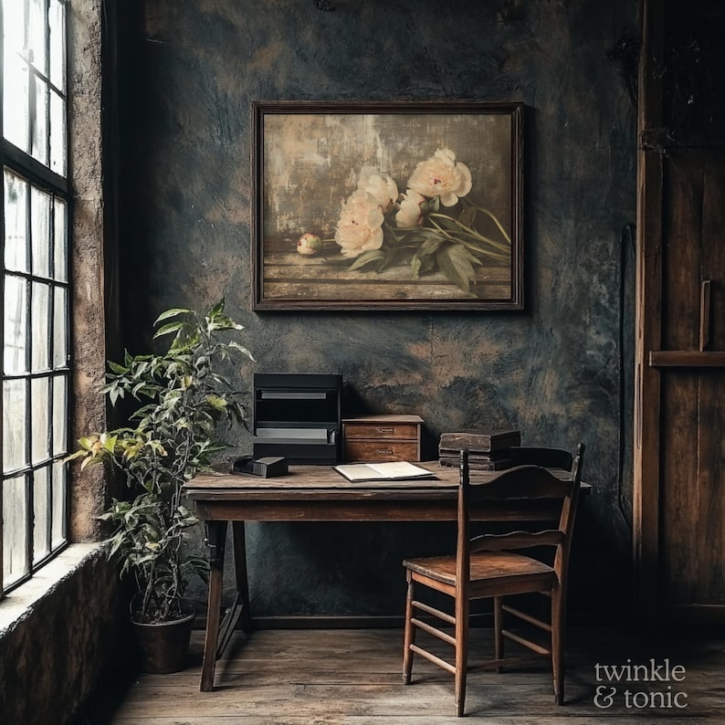 May include: A vintage-style interior scene featuring a wooden desk, chair, and a framed floral painting. A potted plant sits near a large window. The wall is dark with a textured finish. The image has a warm, inviting aesthetic.