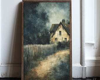 May include: A framed print of a rustic cottage scene. The artwork depicts a weathered house with a picket fence and a dirt path, set against a backdrop of trees and a moody sky. The frame is a dark brown color.
