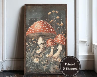 May include: A framed art print featuring a vintage illustration of several red and white spotted mushrooms. The artwork includes detailed depictions of wildflowers and foliage against a dark background. The print is labeled "Printed & Shipped".