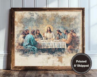 May include: A framed print of the Last Supper, featuring Jesus and his disciples at a table. The artwork has a vintage, distressed look with muted colors. The frame is made of wood. The print includes the text "Printed & Shipped" and "twinkle & tonic".