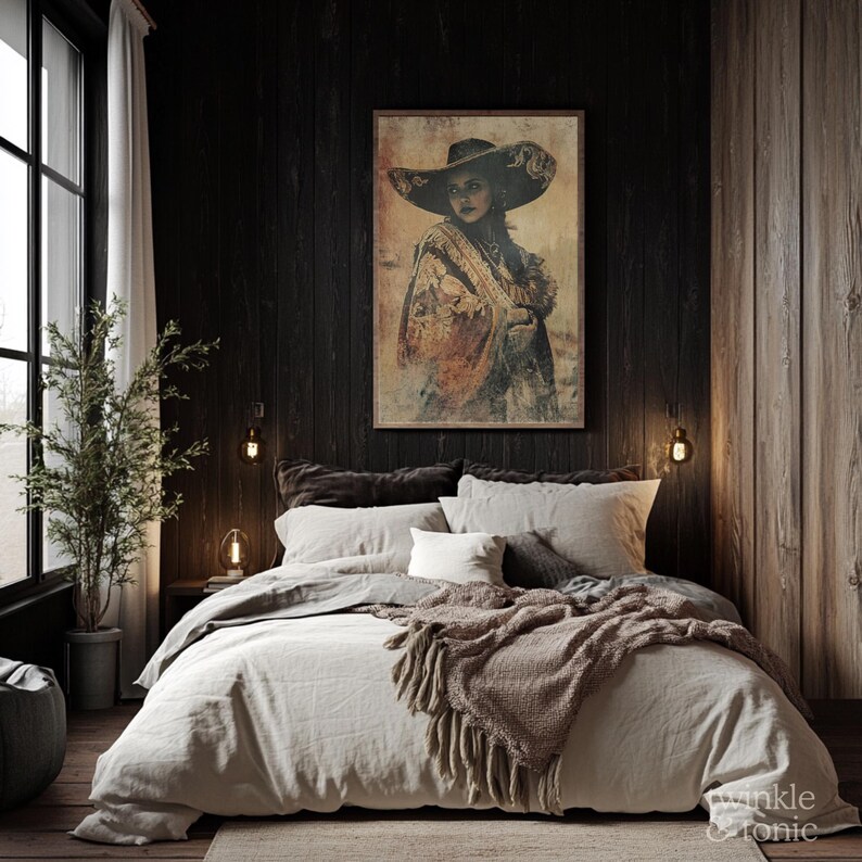 May include: A framed artwork depicting a woman in a wide-brimmed hat and shawl, displayed above a bed with neutral-toned bedding. The room features dark wood paneling and a window with natural light, creating a cozy atmosphere.