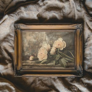 May include: A framed floral print featuring soft pink peonies with green leaves. The artwork has a vintage aesthetic, with a distressed wooden frame and a muted color palette. The background is a textured, neutral tone.