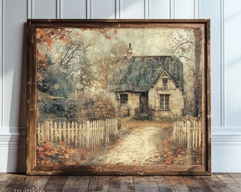 May include: A framed wall art print depicting a stone cottage with a dark shingled roof, surrounded by autumn trees and a white picket fence. A dirt path leads to the front door, and the text "twinkle & tonic" is visible in the bottom left corner.