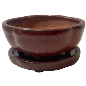 May include: A set of three ceramic mugs with a speckled, matte finish. The mugs are in shades of cream, light gray, and dark gray. Each mug has a simple, minimalist design, perfect for coffee or tea.