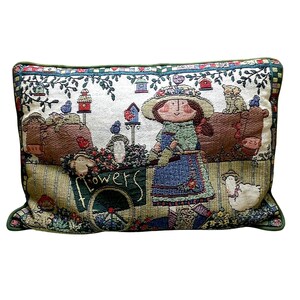 May include: Rectangular tapestry pillow with a green border. The pillow features a whimsical garden scene with a girl, cows, sheep, and birdhouses. The word "flowers" is on a cart. The color palette includes green, brown, blue, and beige.