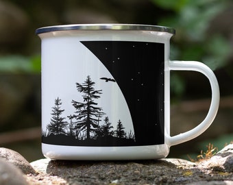 May include: White enamel camping mug with a black silhouette design of trees and a bird flying in front of a crescent moon with stars.