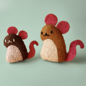 May include: Two needle-felted mouse figures of different sizes. The smaller mouse is dark brown with a light beige belly, pink ears, and a pink tail. The larger mouse is medium brown with a light beige belly, pink ears, and a pink tail.