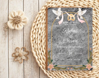 Pode incluir: Um convite de casamento com fundo de pedra cinza e detalhes dourados. O convite apresenta duas pombas brancas com fitas cor-de-rosa e anéis dourados. O texto diz "Juntos com suas famílias, Rufus & Olivia, convidam você a se juntar ao seu casamento, Domingo, 31 de dezembro às 9:00 AM, 2024, 123 Anywhere St., Any City."