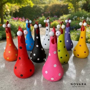 May include: A collection of whimsical, hand-painted ceramic chicken figurines in various colors, including red, orange, blue, black, white, pink, green, purple, and yellow. Each chicken features a polka dot pattern and a comical expression, perfect for home decor.