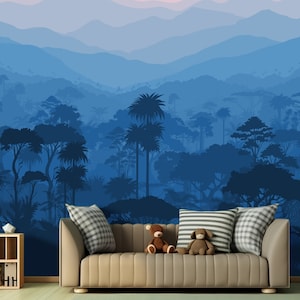 May include: A blue and white mountain range wallpaper mural with a silhouette of trees and a couch in the foreground.