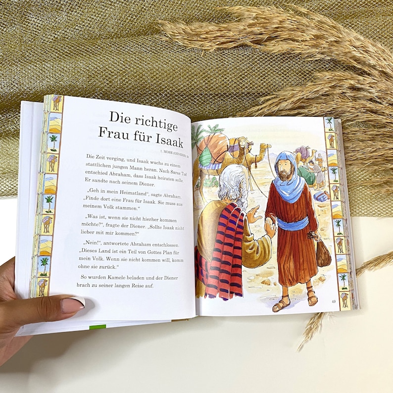 May include: An illustration from a children's book depicting a man in a red and black robe talking to another man in a blue robe. The text reads "The right wife for Isaac." The illustration is set in a desert landscape with camels and other people in the background.