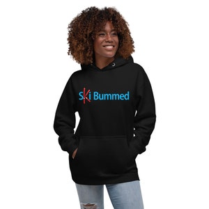 May include: A black hoodie with a blue and red graphic that says "Ski Bummed".