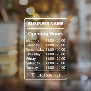 May include: A white sign with rounded corners and a black border displays the business name and opening hours. The sign has a phone icon and phone number: 0161 536 5731.
